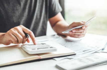 Man using calculator