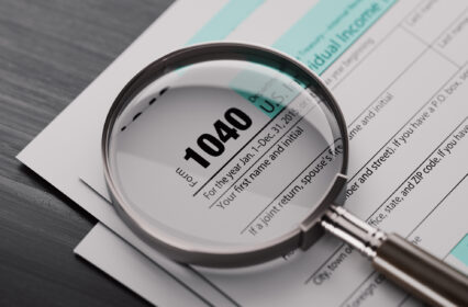 1040 Tax Form And A Magnifying Glass